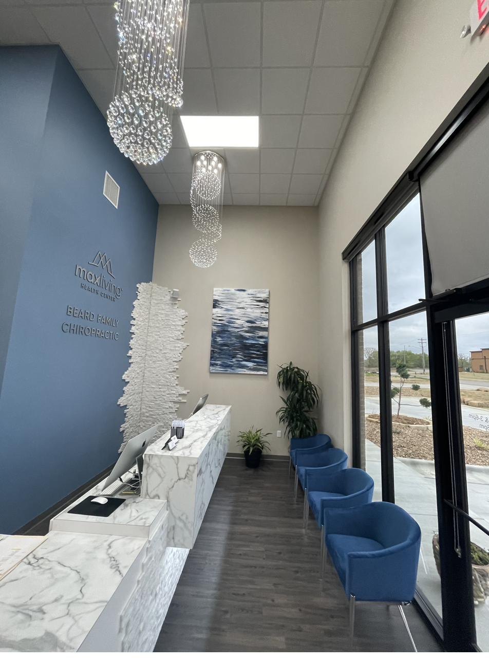 Healthcare center reception with marble desk and crystal chandeliers